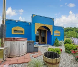 Front of Marrakesh Aladdin-inspired cabin with hot tub and hammock at Nature Mystique Retreat