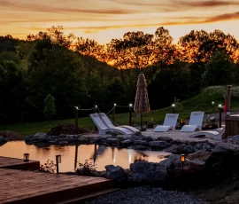 Sunset view of the sandy beach and natural swimming hole at Nature Mystique Retreat