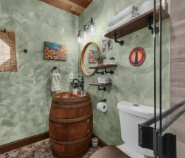 Whiskey barrel bathroom sink in Forest Hobbit-inspired cabin at Nature Mystique Retreat