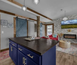 Kitchen island facing living room and front door in Tangier Aladdin-inspired cabin at Nature Mystique Retreat